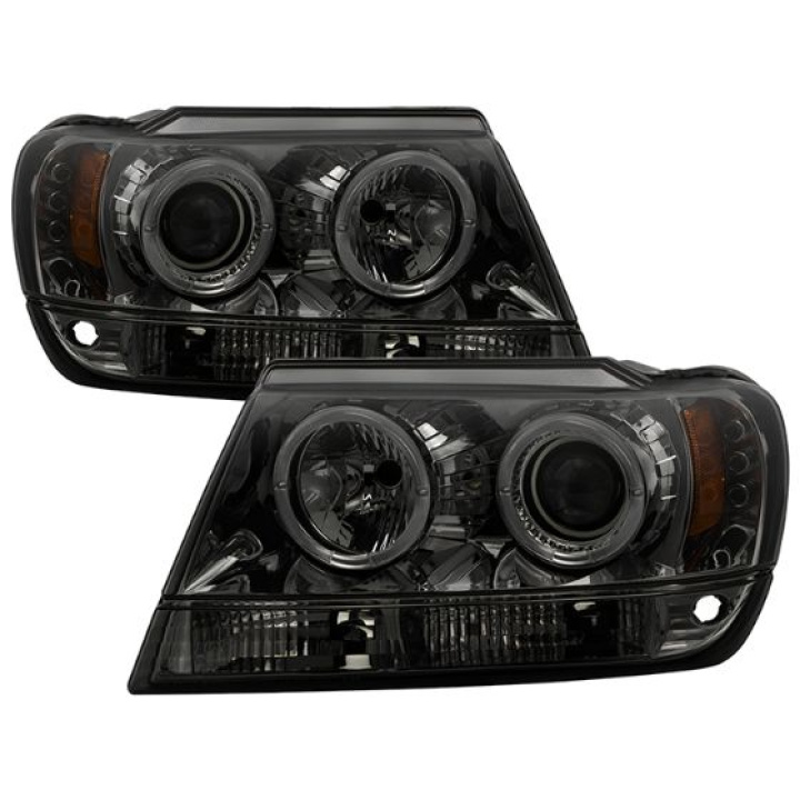 Jeep Grand Cherokee 99-04 Projector Headlights - LED Halo - LED ( Replaceable LEDs ) - Smoke Spyder Auto in the group Select car model / Jeep / Grand Cherokee WJ-WG 1999-2004 / Styling at DDESIGN Scandinavia AB (PRO-YD-JGC99-HL-SMC)